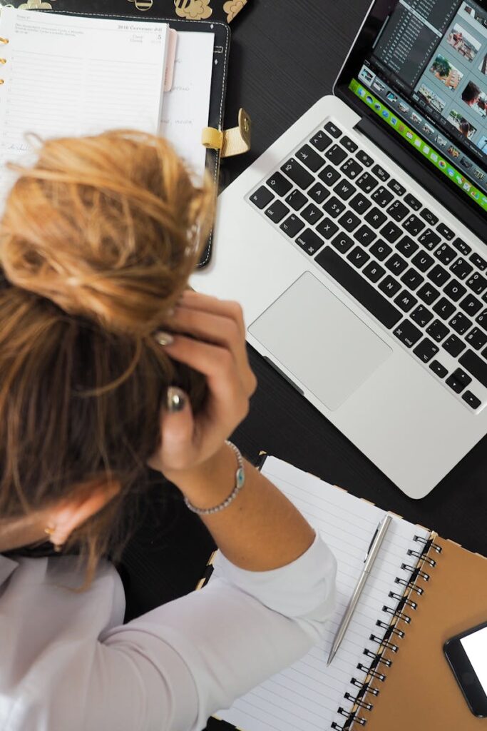 Woman Sitting in Front of Macbook